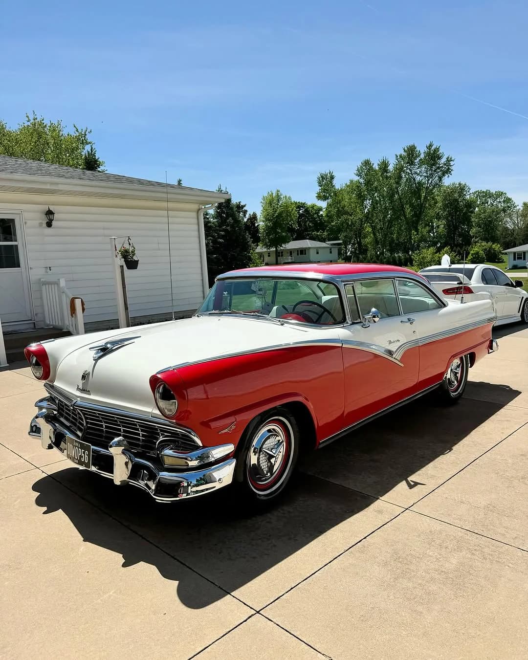 Red and white 1956 Ford Fairlane after detailing