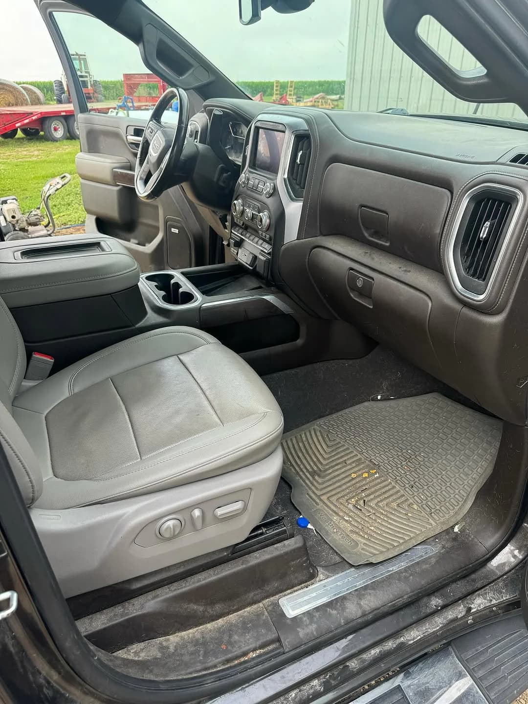 Truck carpet and seat-track area during an interior detail