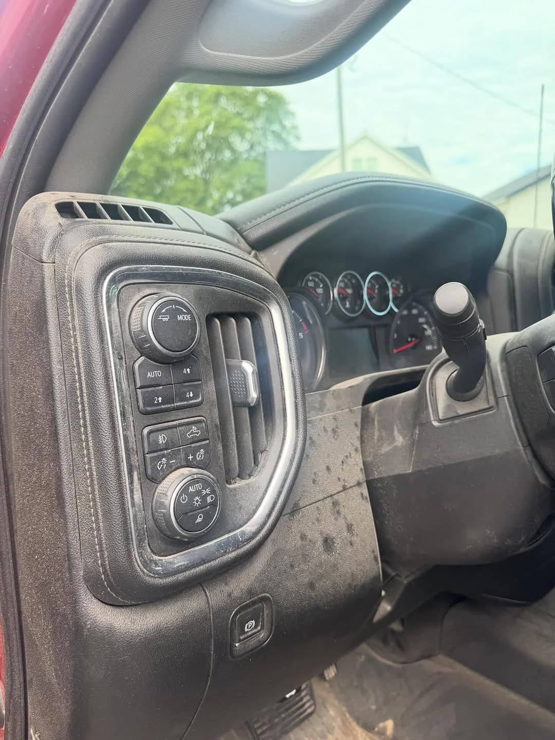 Work-truck driver cabin showing dirt, dust, and buildup before detailing